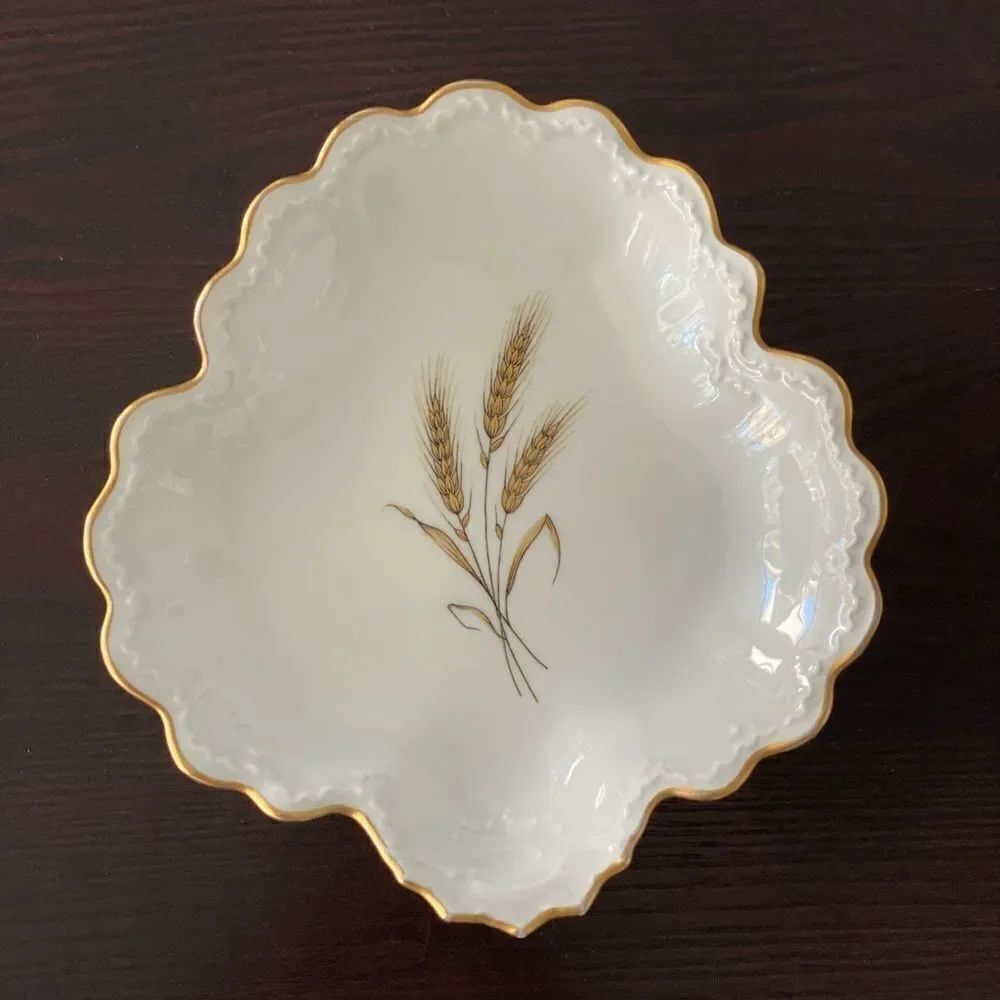 Limoge Bowl scalloped edge. White with gold trim. Wheat in center.